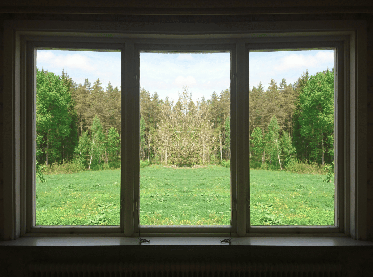 Broken house window repair with damaged glass