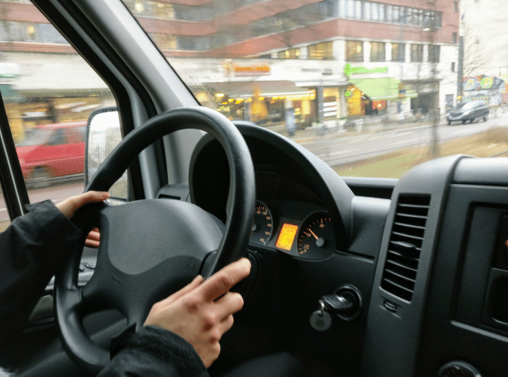 Driver viewing the road through a vehicle windshield