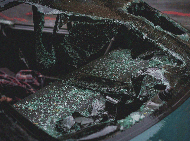 Severely damaged windshield with shattered glass